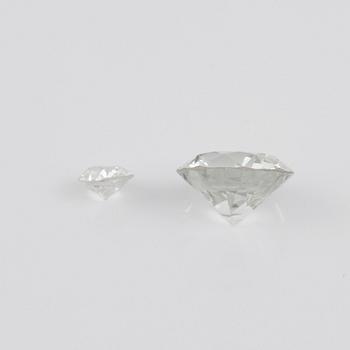 Two loose old-cut diamonds, 1.56 cts circa J/VVS, and 0.18 cts.