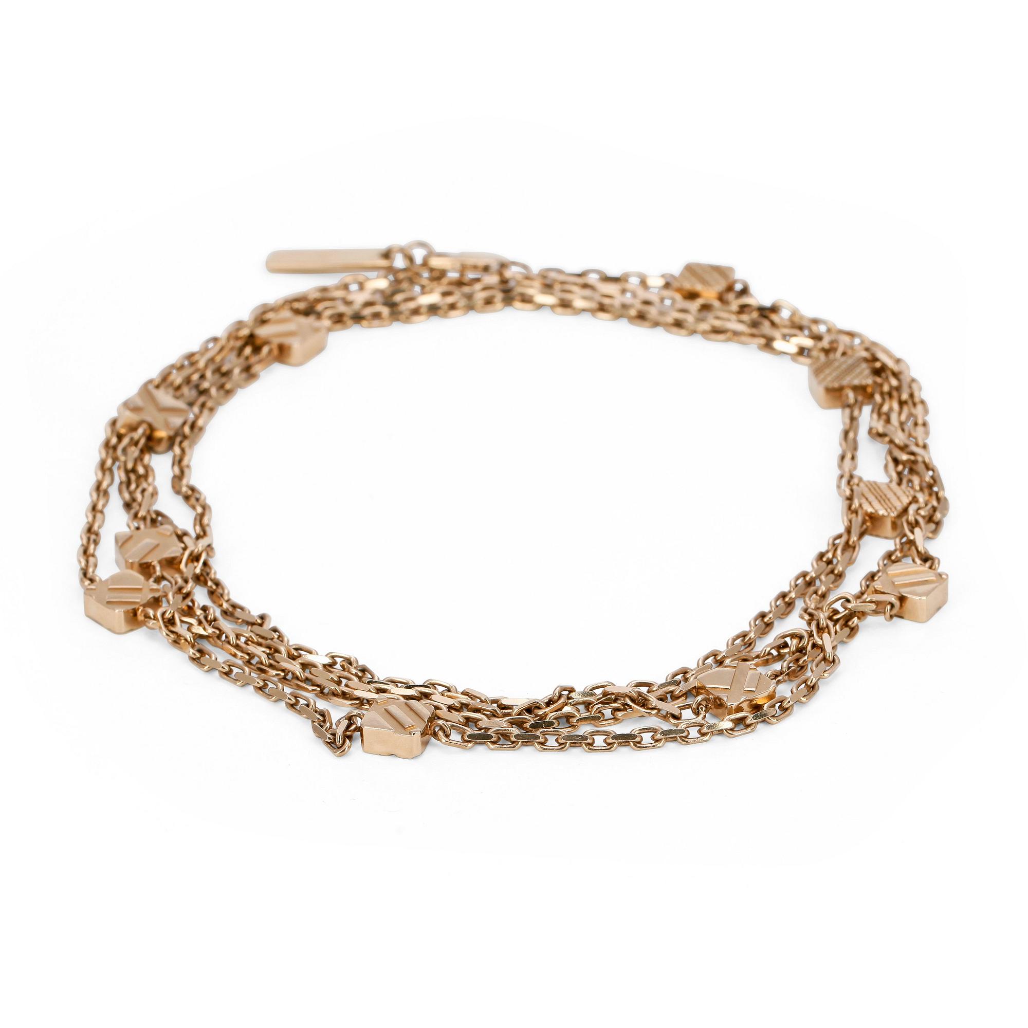 BURBERRY, a gold colored necklace.