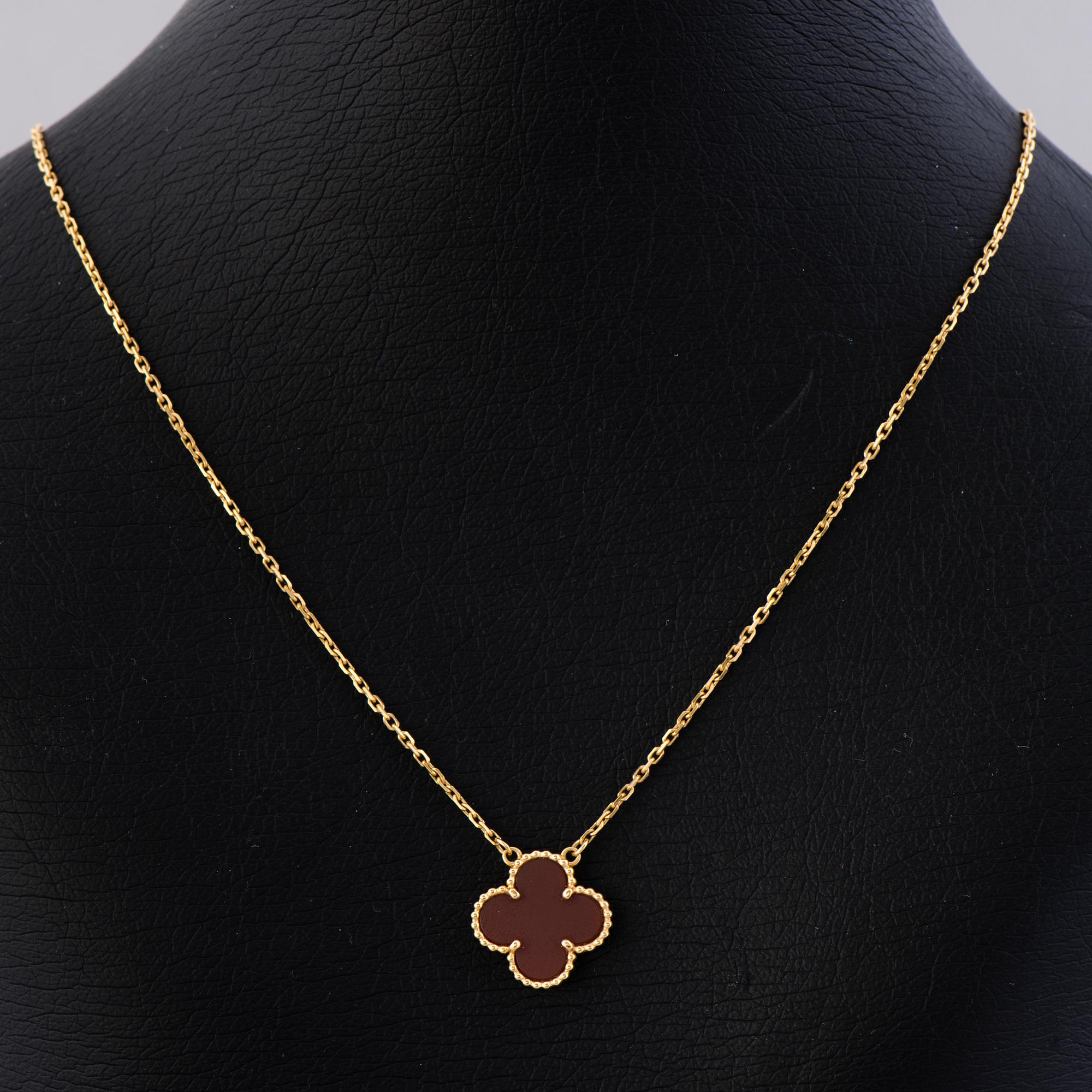 A VAN CLEEF & ARPELS NECKLACE, 'Alhambra'. 18K gold, carnelian.