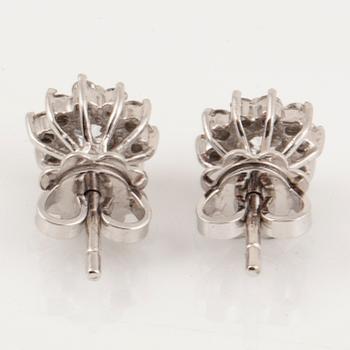 Brilliant-cut diamond floral shaped earrings.