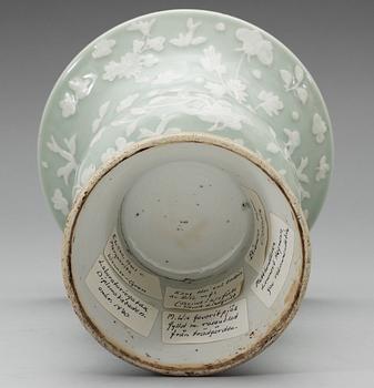 A celadon slip decorated vase, Qing dynasty, Kangxi (1662-1722).