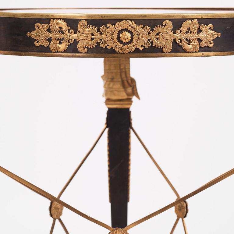 A French Empire-style gilt and patinated bronze  gueridon, later part of the 19th century.