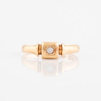 Faceted white stone ring.