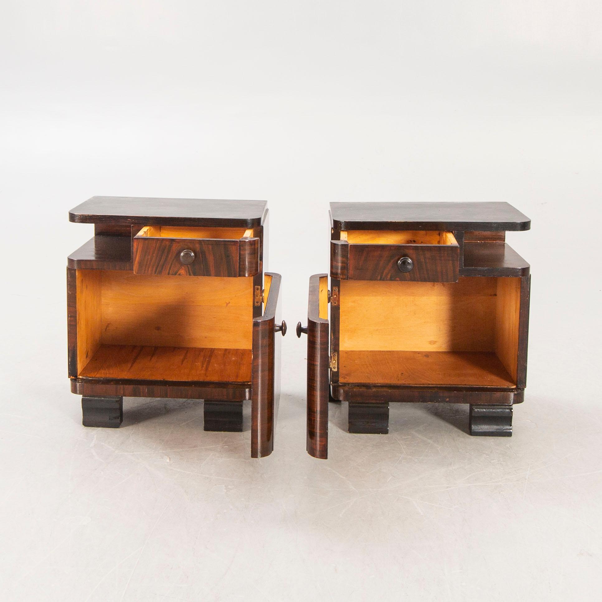 A pair of Art Deco 1940s walnut bedside talbes.