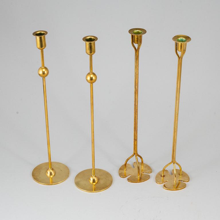 FIRMA SVENSKT TENN, 2+2 brass candlesticks. Designed by Estrid Ericson and Josef Frank.