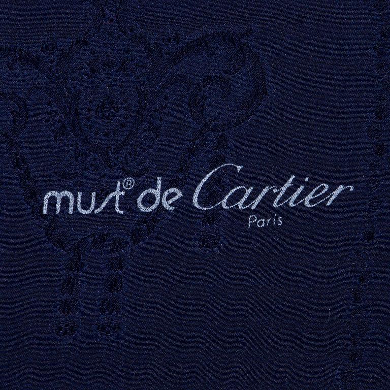 must de Cartier, a silk scarf.