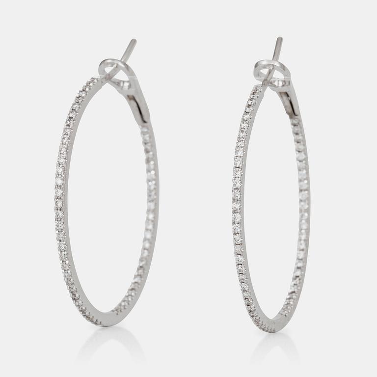 A pair of brilliant-cut diamond hoop earrings. Total carat weight circa 1.00 ct.