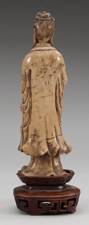 A stone sculpture of Guanyin, Qing dynasty (1644-1912).