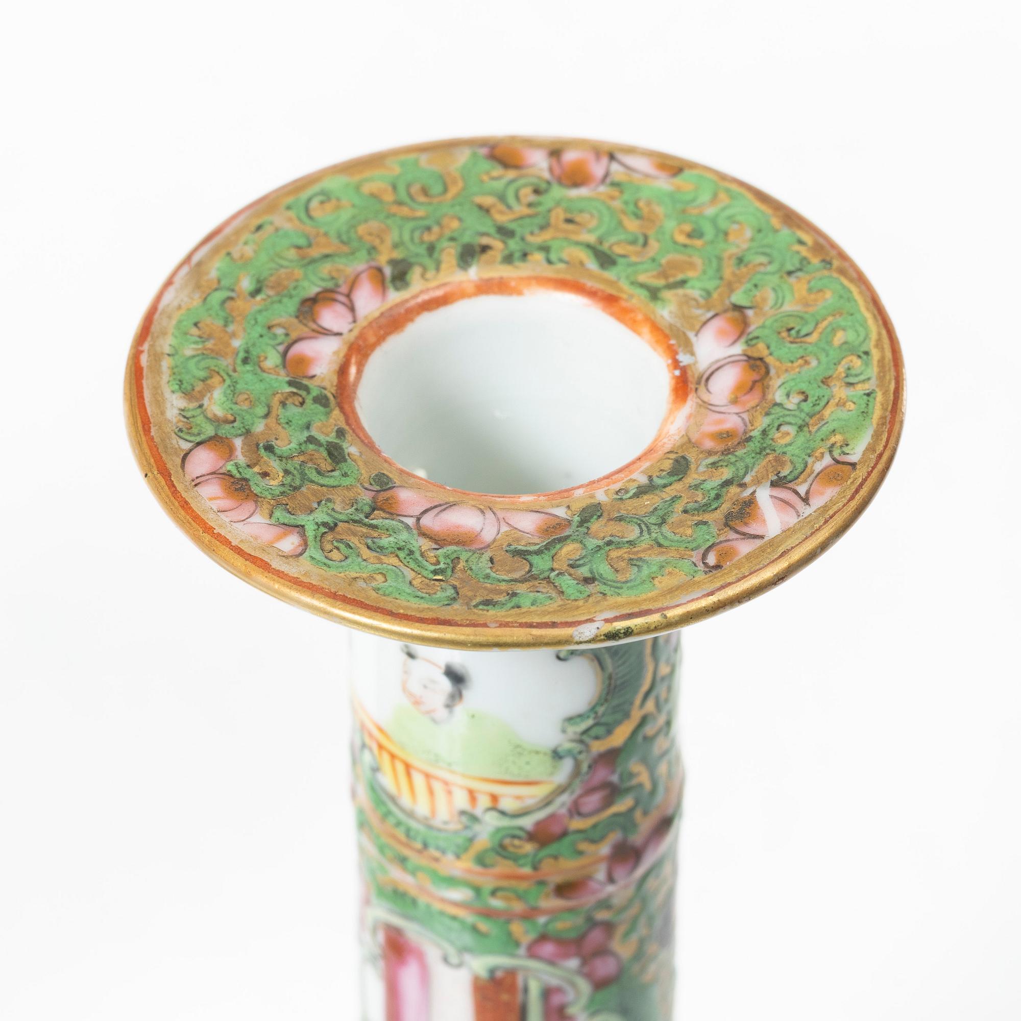 A pair of famille rose Canton candle sticks, Qing dynasty, 19th century.