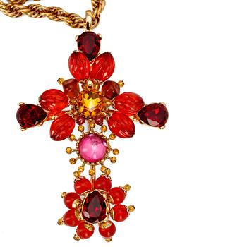 CHRISTIAN LACROIX, a gold colored necklace with flower shaped pendent.
