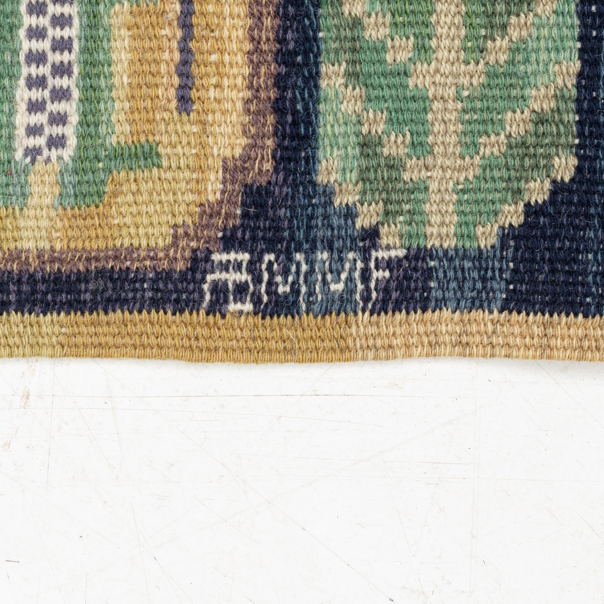 Märta Måås-Fjetterström, a flat weave textile, 'Medaljongerna',c. 41 x 87 cm, signed AB MMF.