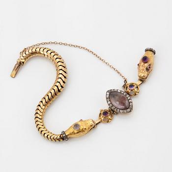 An 18K gold bracelet set with amethysts and old-cut diamonds.