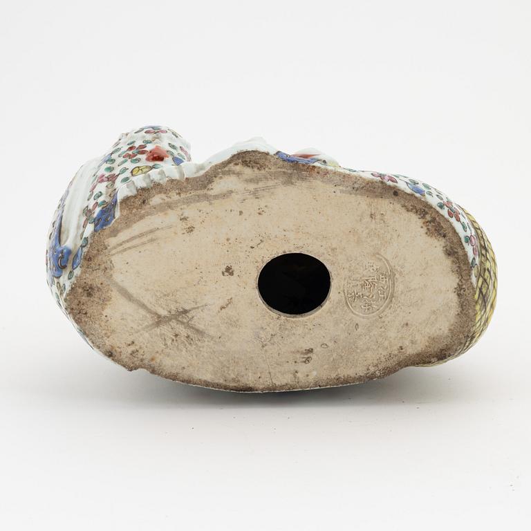 A porcelain 'Budai' figure, China, 20th Century.