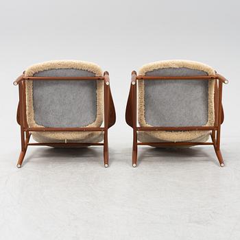 A pair of model FD 136 easy chairs with new sheepskin upholstery by Finn Juhl for France & Son, designed 1958.