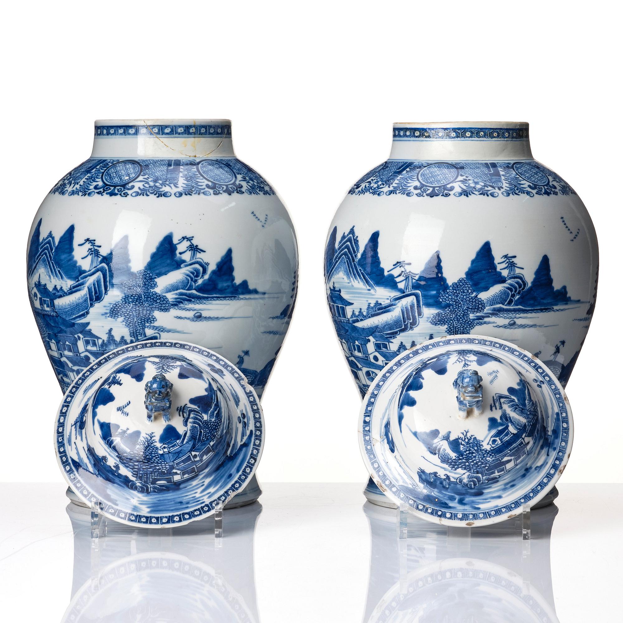 A pair of blue and white Chinese porcelain jars with covers. Qing dynasty, Qianlong (1736-95).