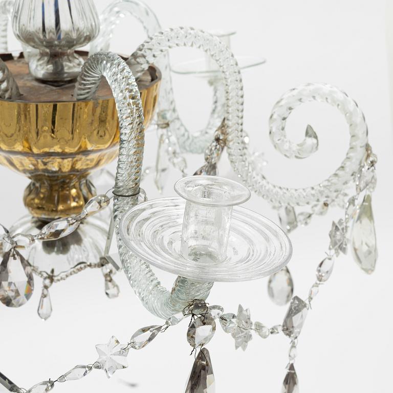 A European glass three-light chandelier, circa 1800.