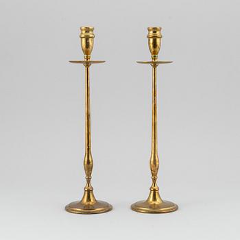 A pair of model 2539 brass candlesticks, for Firma Svenskt Tenn, designed ca 1949-50.