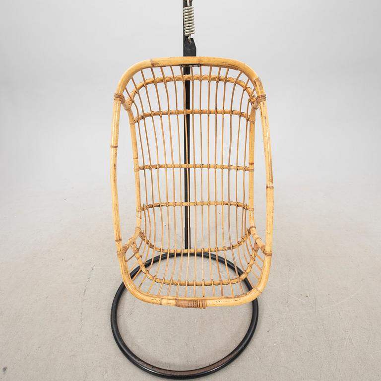 A bamboo and rattan hanging chair from the second half of the 20th century.