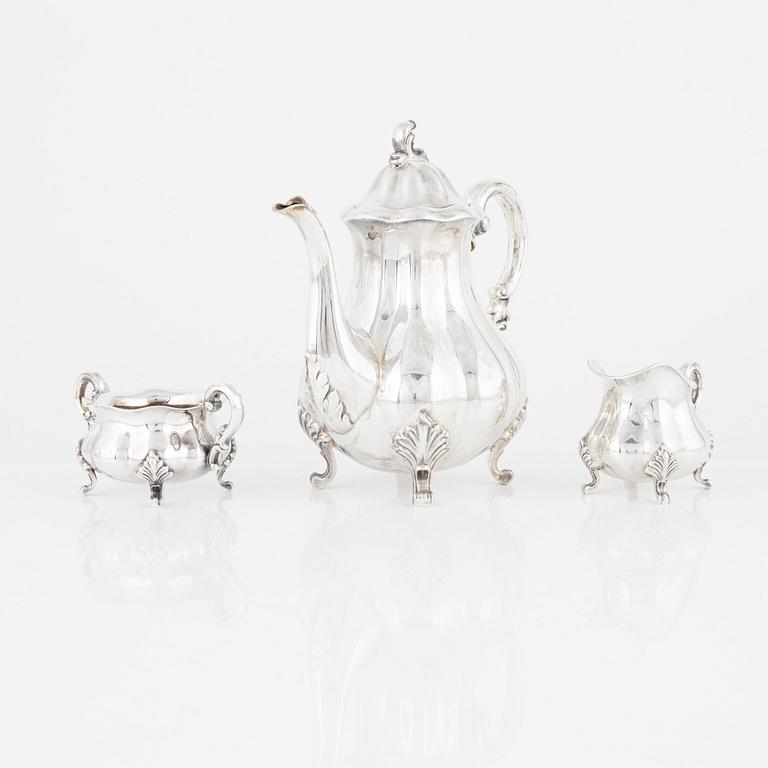 A Rococo-Style Sterling Silver Coffee Pot, Creamer and Sugar Bowl, Swedish import marks.