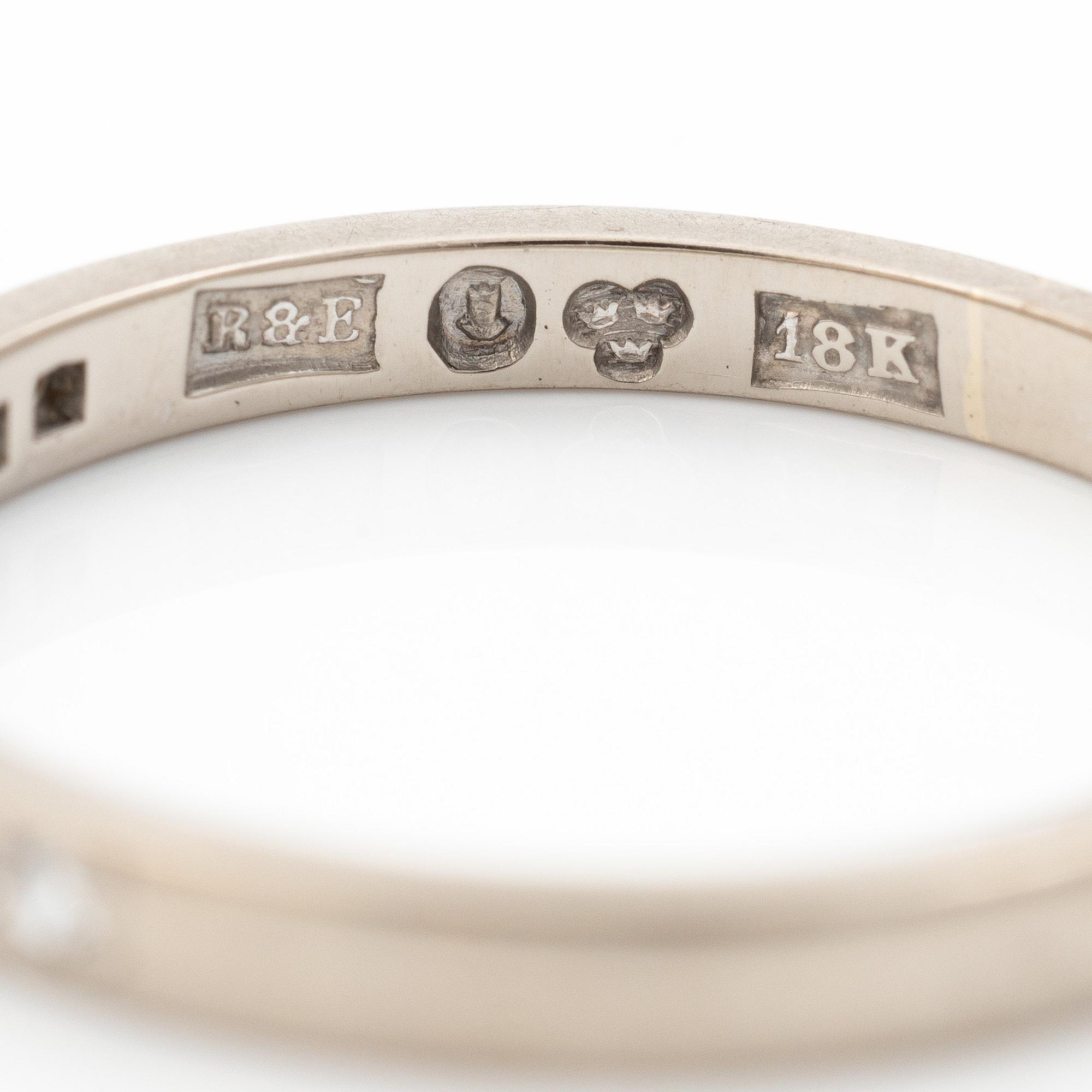 18K white gold half eternity ring with octagonal-cut diamonds.