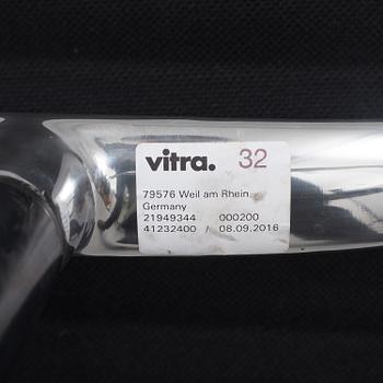 A 'EA 104 Swivel' armchair by Charles & Ray Eames, Vitra, 2016.