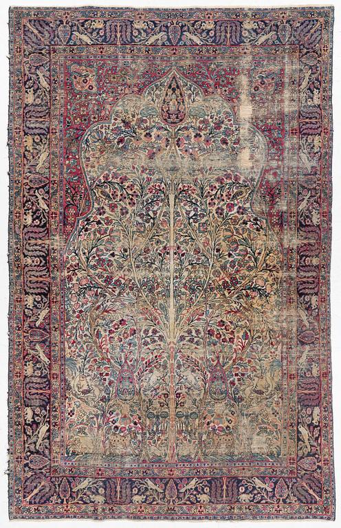 A semi-antique Kerman carpet, c. 325 x 203 cm.