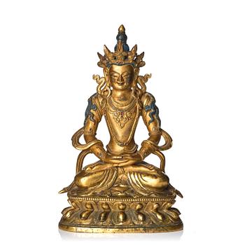1056. A gilt-bronze figure of Amitayus, Qing dynasty, Mongolian, 18th century.