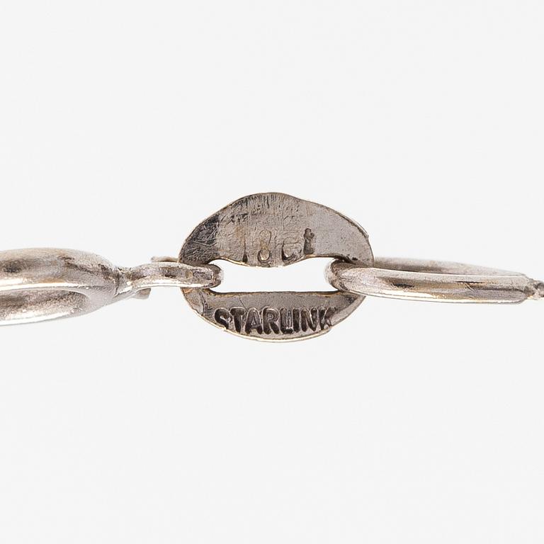 Kaulakoru, 18K valkokultaa ja timantteja n. 0.56 ct yht.