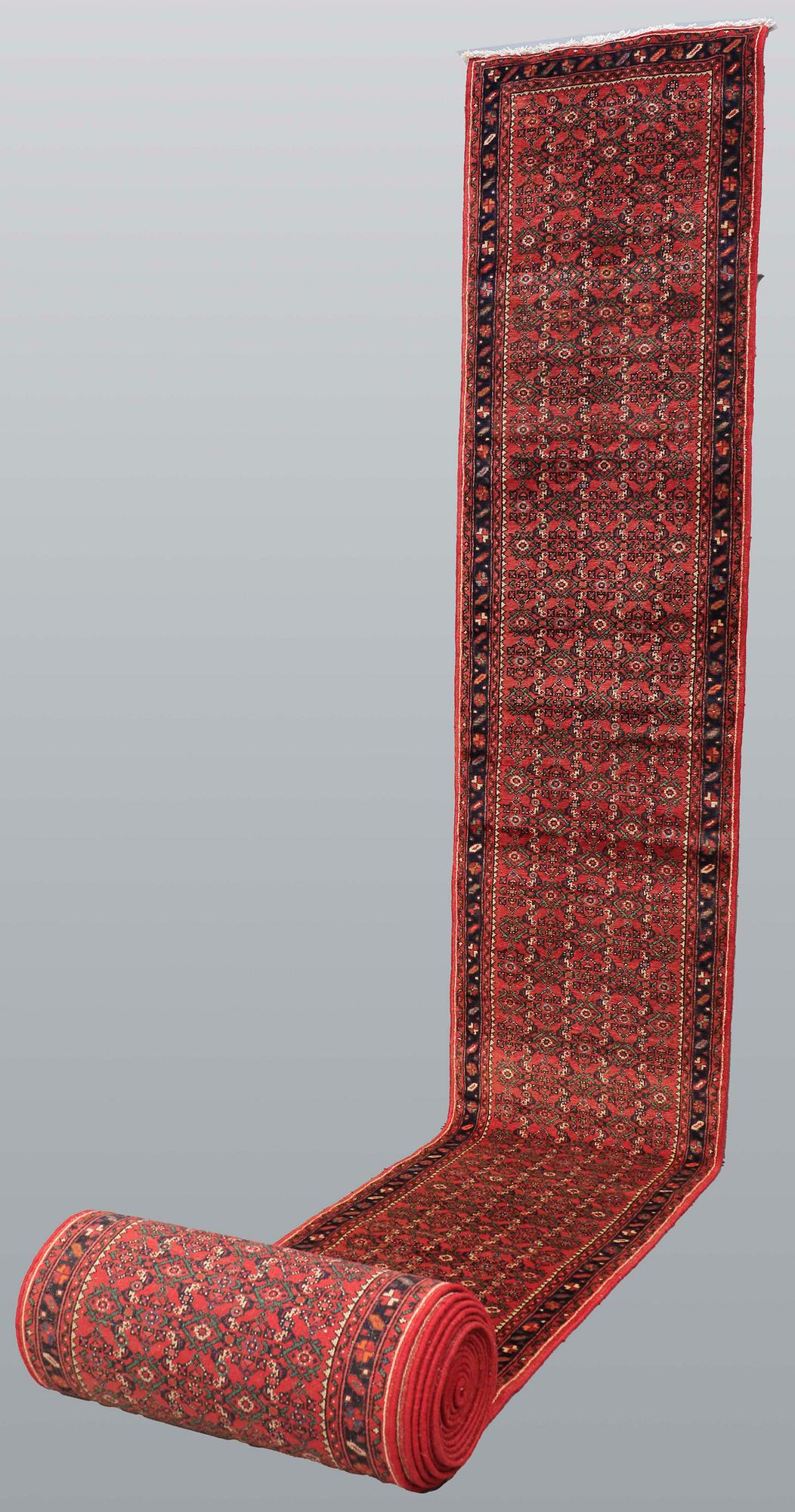 A Hosseinabad runner, approx. 1360 x 80 cm.