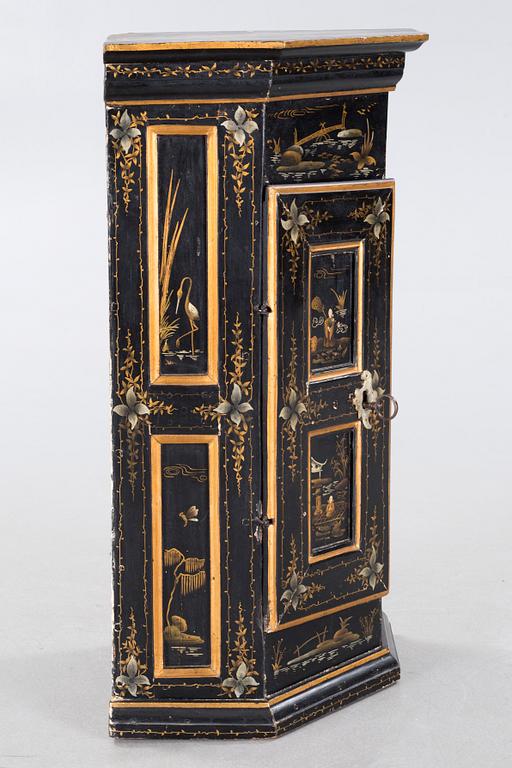 An 18th century corner cabinet.