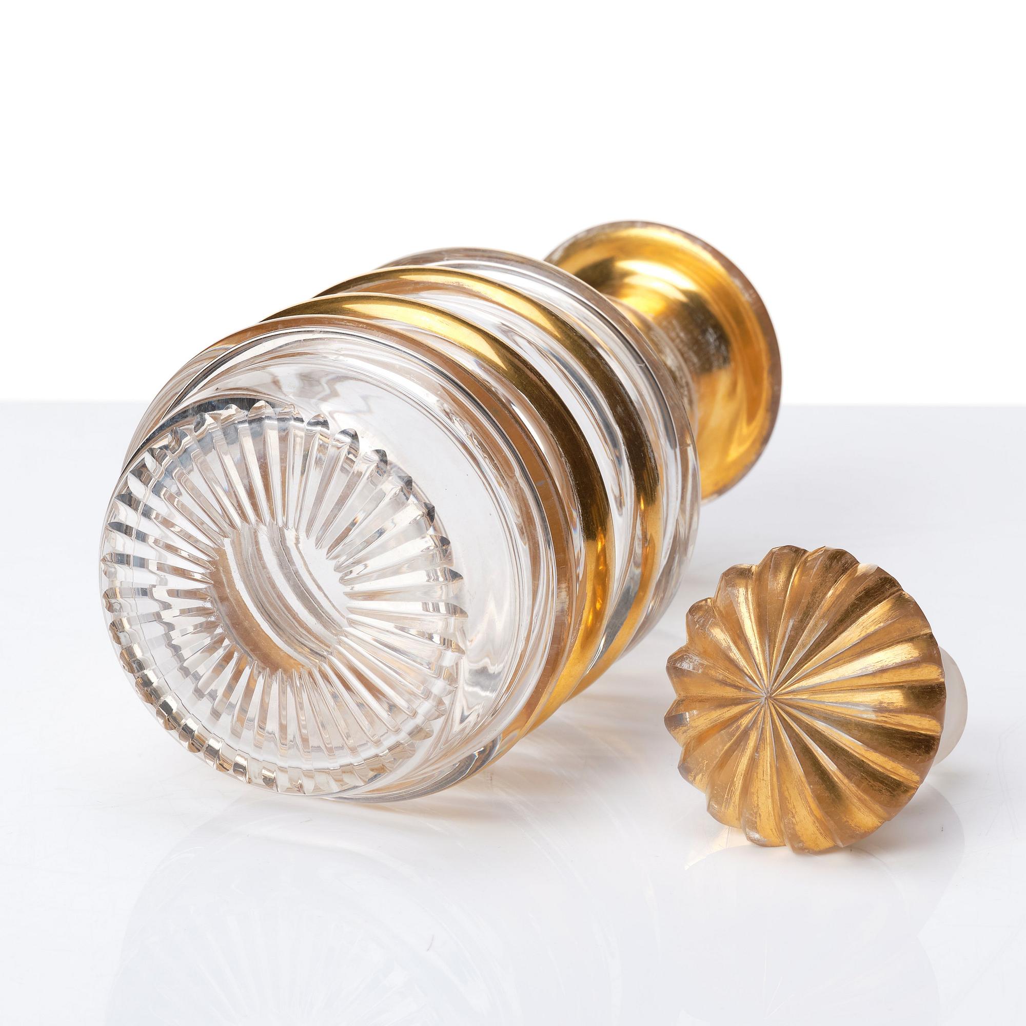 A set of Russian glasses (13 pcs.) and a bottle with stopper, 19th Century.