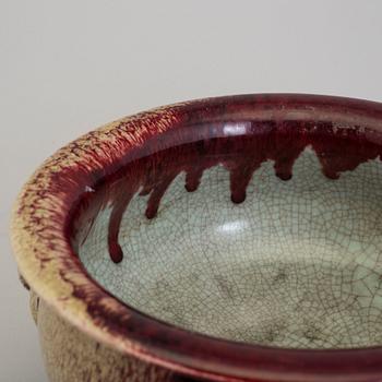 A large red glazed tripod censer, 20th century.