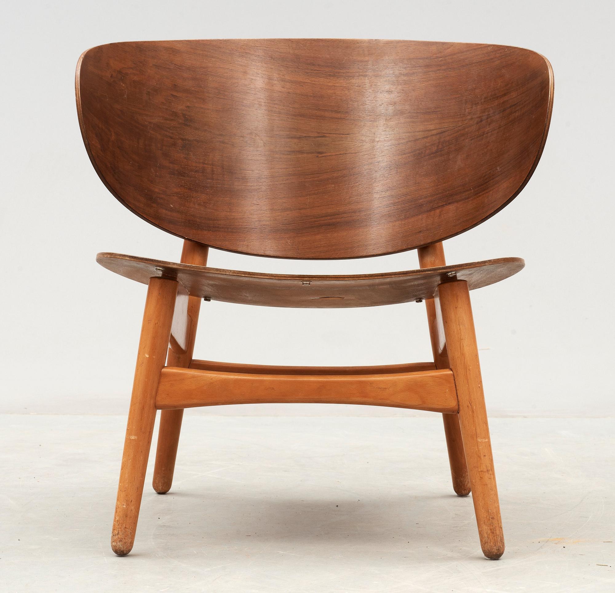 A Hans J Wegner mahogany and beech easy chair, Denmark 1950's.