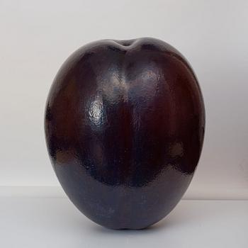 A Hans Hedberg faience sculpture of a plum, Biot, France.