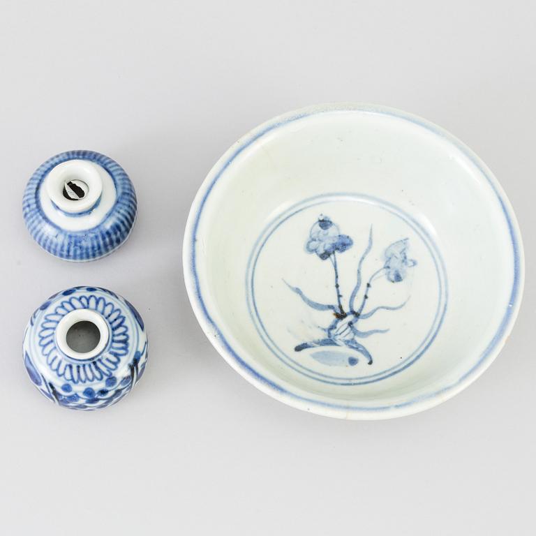 A blue and white Chinese porcelain bowl and two miniature jars for the South East Asian market, probably Ming dynasty.