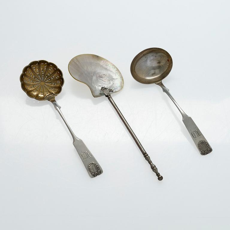 A pair of Russian silver salt cellars, a sprinkle spoon, a sauce ladle, and a tea strainer, Finnish marks.