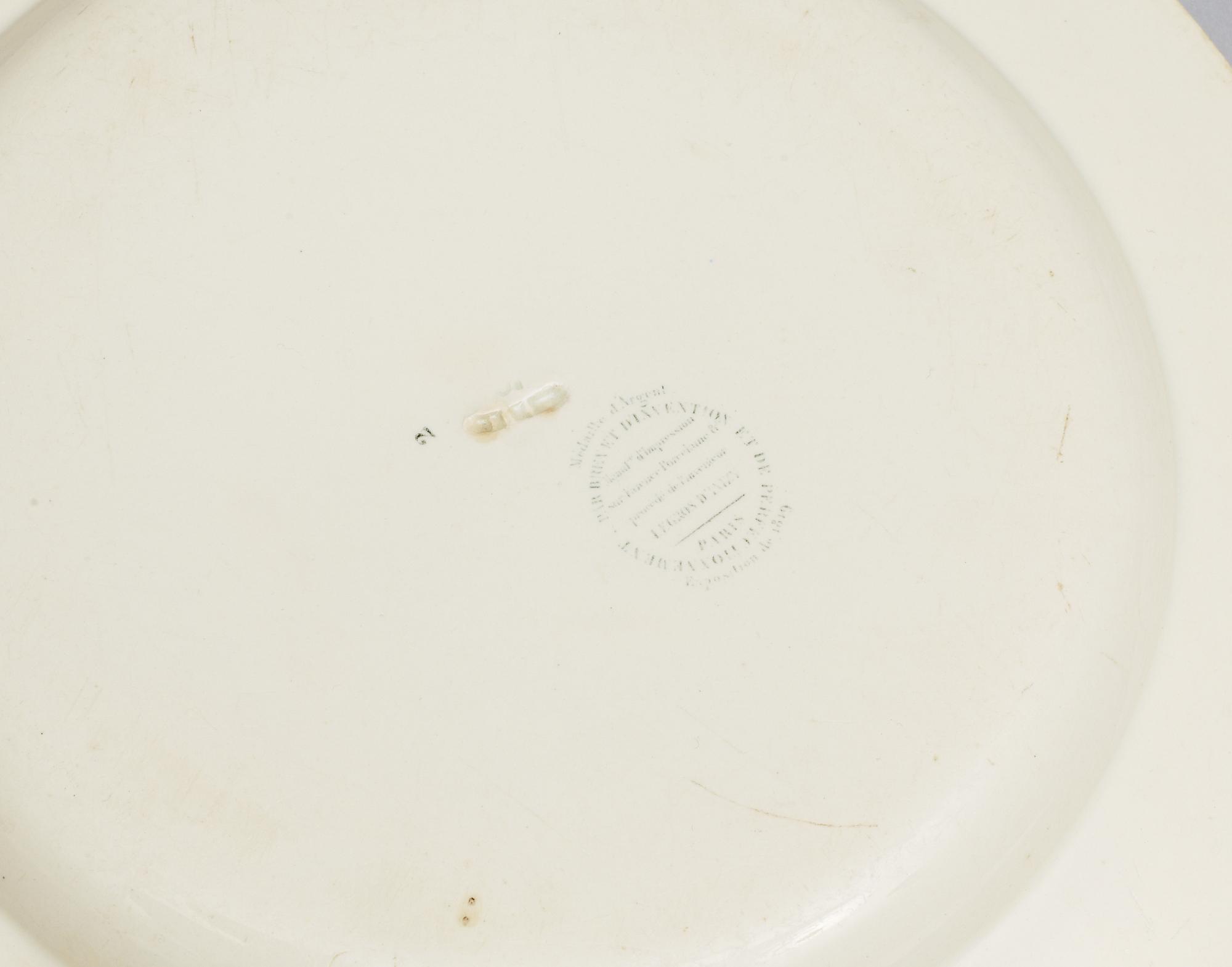 A set of nine French dinner plates, early 19th Century.