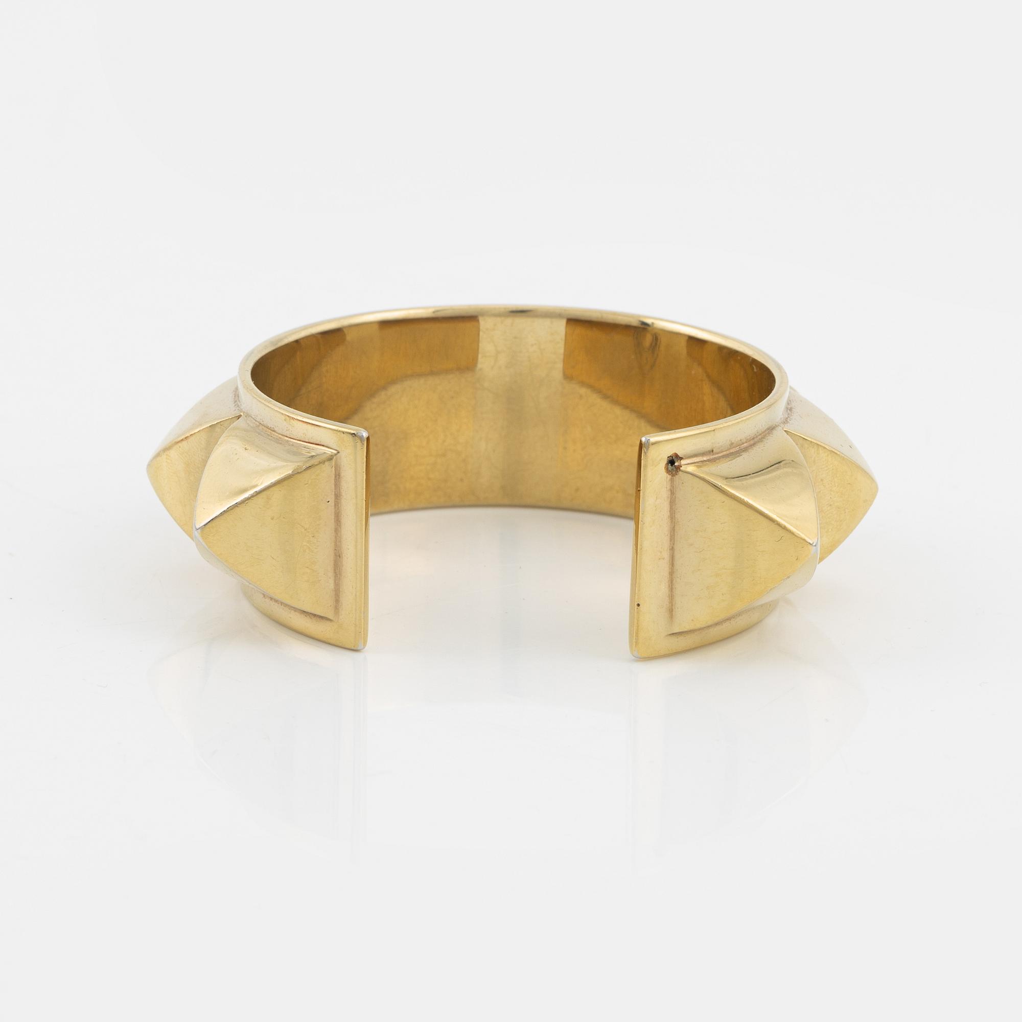 Hermès, a vintage gold tone stud bangle.