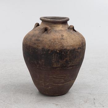 A ceramic urn, 19th century or older.