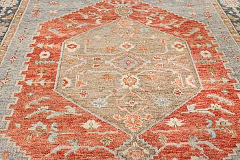 An oriental carpet with Mamluk design, c. 359 x 281 cm.