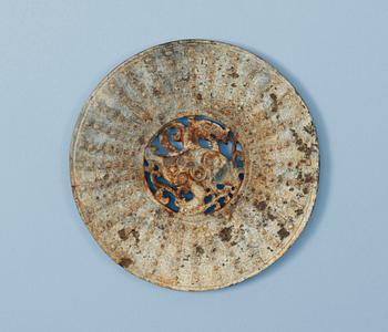 1270. A carved archaistic nephrite bi disc.