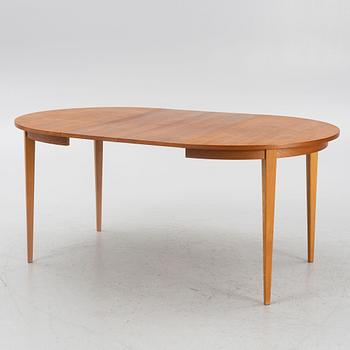 A teak-veneered dining table, mid 20th century.