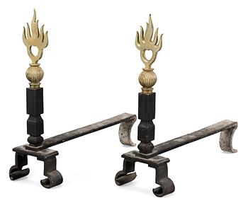591. A pair of brass and cast iron firedogs, attributed to Petrus Forssberg, 1920's.