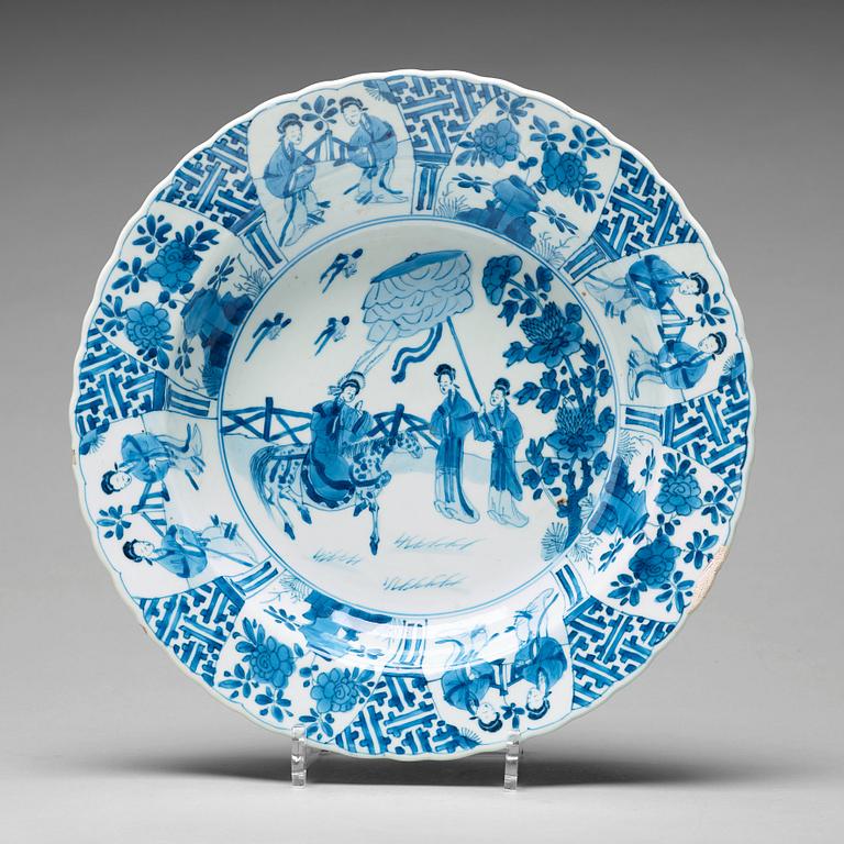 A large blue and white deep dish, Qing dynasty, with Kangxi six character mark and period (1662-1722).