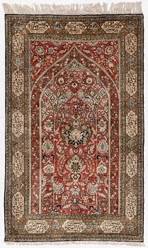 A silk Qum rug, c. 172 x 105 cm.