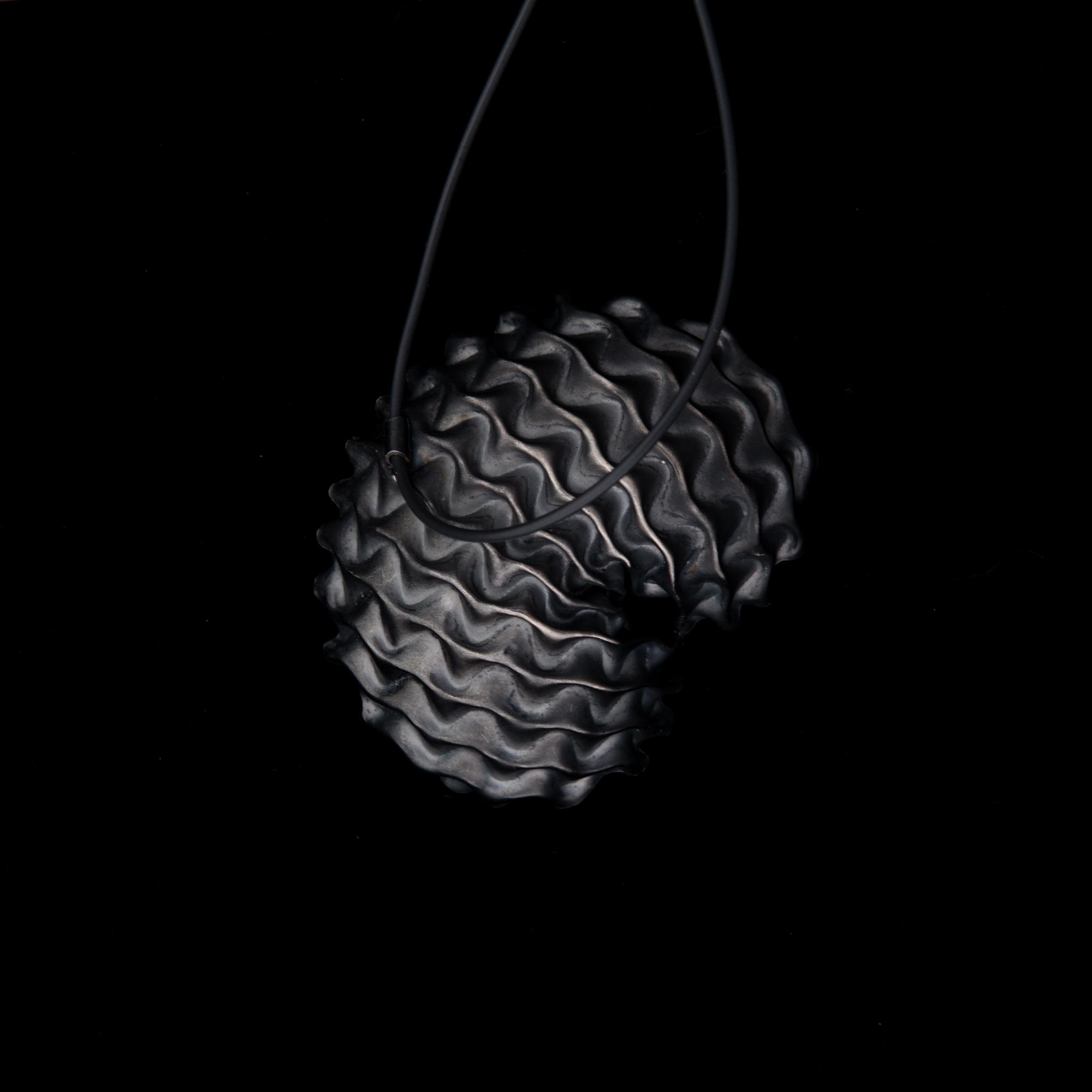 A NECKLACE, "Shelter", oxidated silver, black rubber band, 2010.