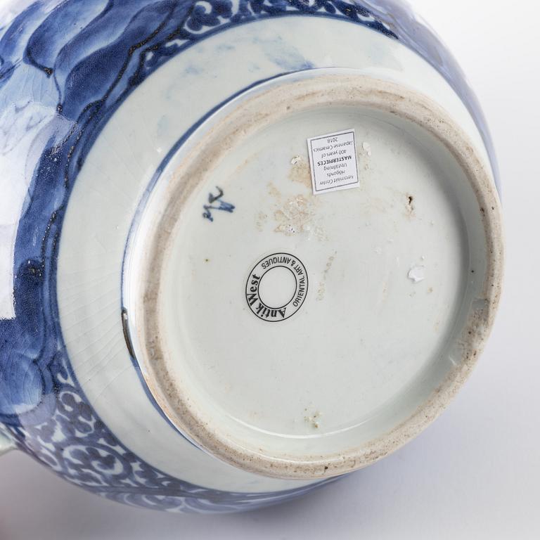 A large Japanese blue and white jug, 17th/18th Century.