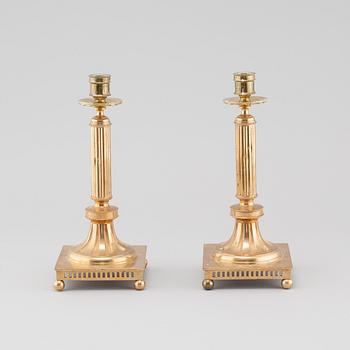 A pair of gustavian style brass candle sticks by Grillby Metal factory, Sweden, first half of the 20th century.