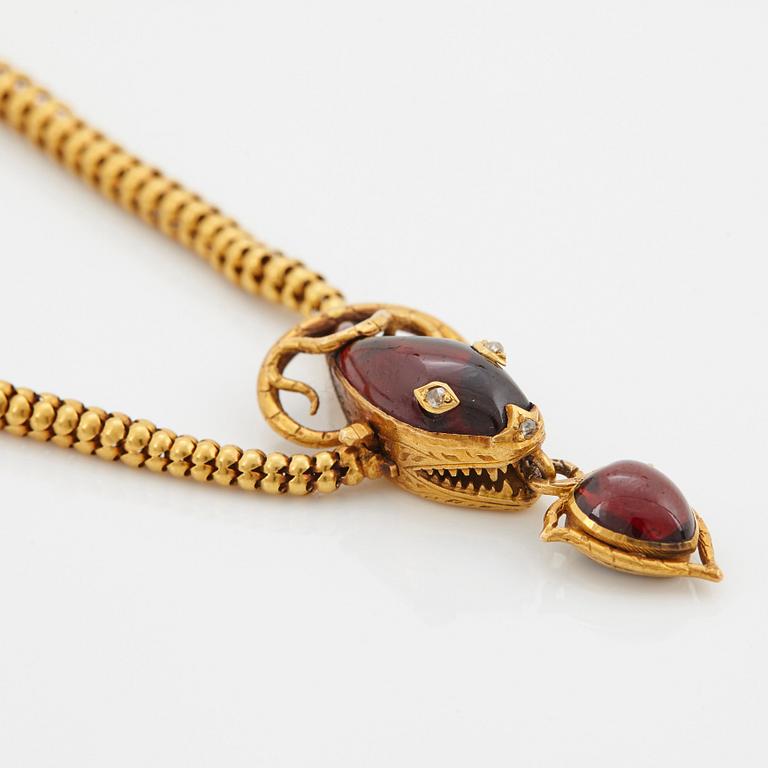 A 14K gold necklace set with garnets and rose-cut diamonds.