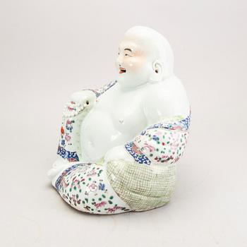 A large porcelain figure of a buddai, China, 20th Century.